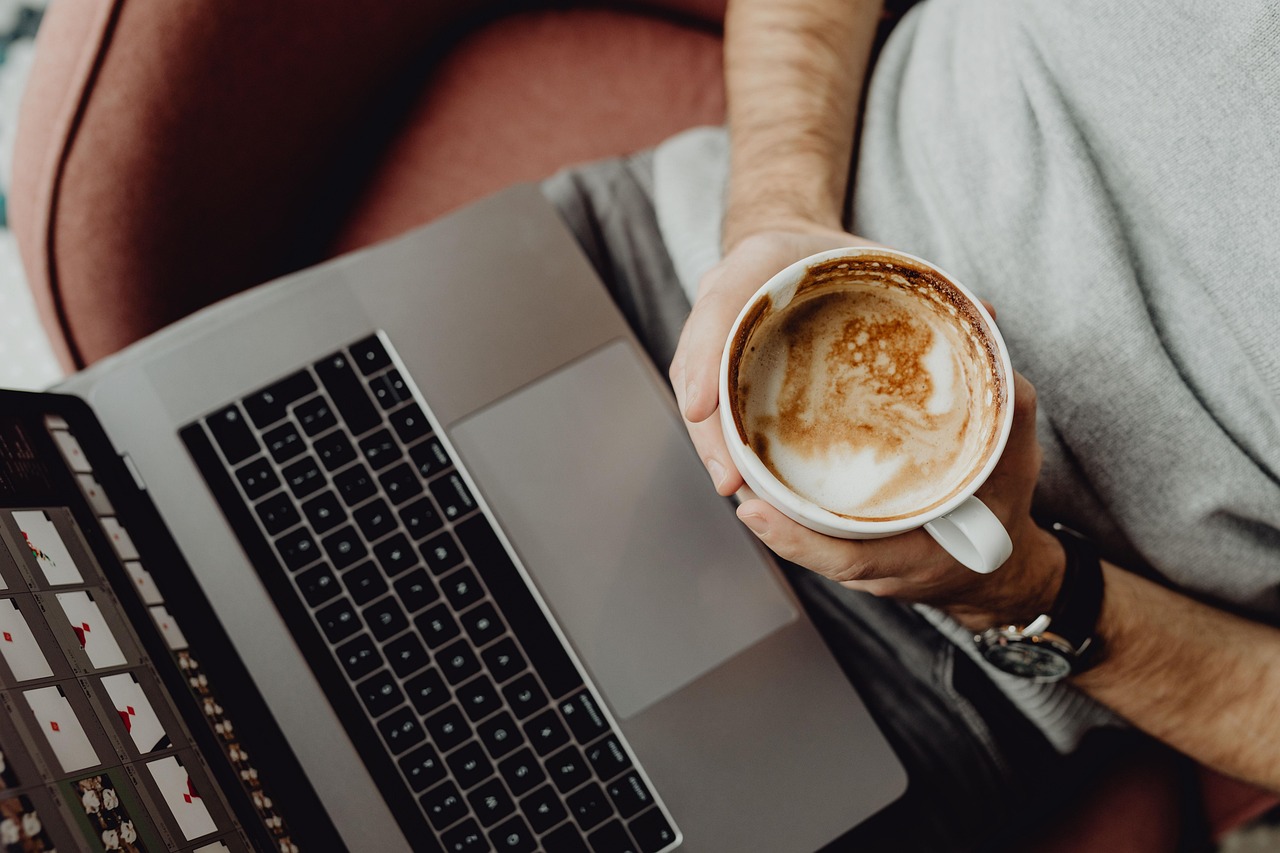 Coffee, cup, computer — TCG Grading Insights: How AI Is Redefining Trading Card Evaluation for Collectors